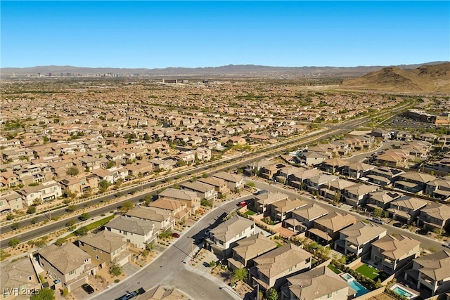 aerial overview of property's location featuring nearby suburban area and mountains