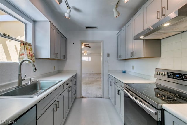 1127 Melville Dr, Las Vegas, NV 89102 - kitchen featuring electric stove, under cabinet range hood, a sink, light countertops, and ceiling fan