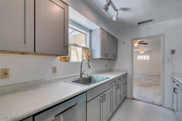 1127 Melville Dr, Las Vegas, NV 89102 - kitchen with a sink, dishwasher, ceiling fan, light countertops, and gray cabinetry