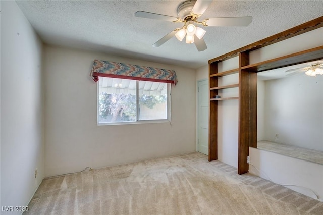 1127 Melville Dr, Las Vegas, NV 89102 - unfurnished bedroom with a textured ceiling, light colored carpet, a closet, and a ceiling fan