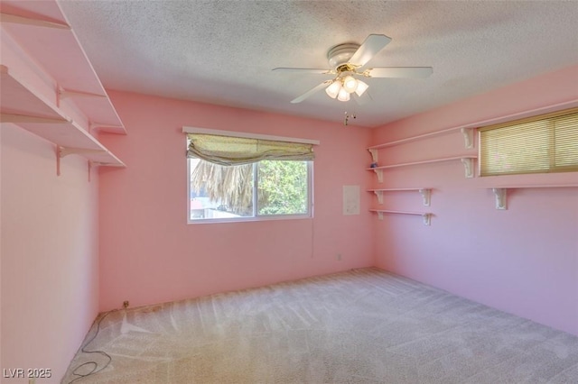 1127 Melville Dr, Las Vegas, NV 89102 - carpeted empty room with a textured ceiling and a ceiling fan