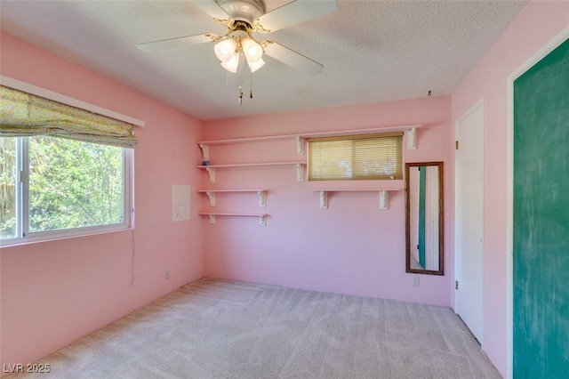 1127 Melville Dr, Las Vegas, NV 89102 - empty room featuring carpet floors, a ceiling fan, and a textured ceiling