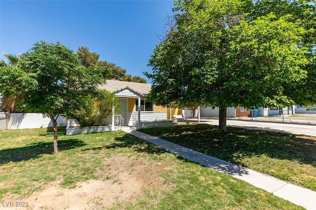 1127 Melville Dr, Las Vegas, NV 89102 - view of property hidden behind natural elements with a front lawn and a porch