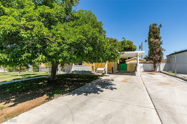 1127 Melville Dr, Las Vegas, NV 89102 - obstructed view of property with concrete driveway and a carport