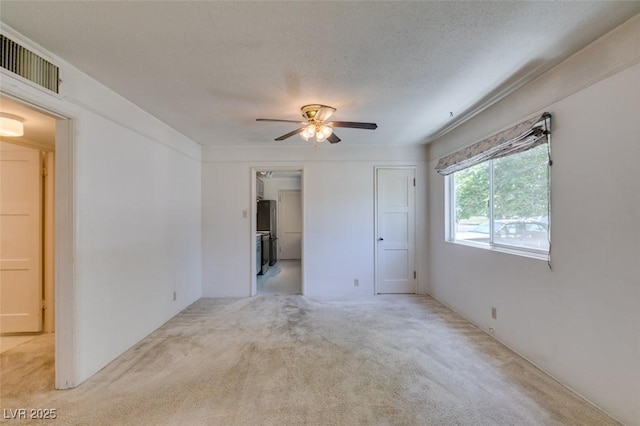 1127 Melville Dr, Las Vegas, NV 89102 - spare room with light colored carpet and ceiling fan