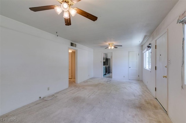 1127 Melville Dr, Las Vegas, NV 89102 - unfurnished living room with a ceiling fan and light colored carpet