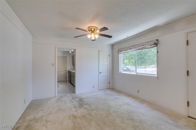 1127 Melville Dr, Las Vegas, NV 89102 - unfurnished bedroom with light colored carpet, ensuite bath, and a ceiling fan