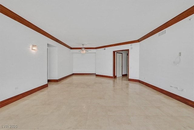 unfurnished room featuring a ceiling fan, crown molding, and baseboards