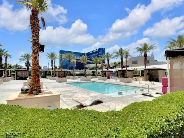 community pool with a patio area