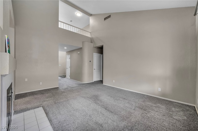 2124 Rising Mist St, Las Vegas, NV 89134 - unfurnished living room with carpet floors, baseboards, high vaulted ceiling, a fireplace, and beamed ceiling
