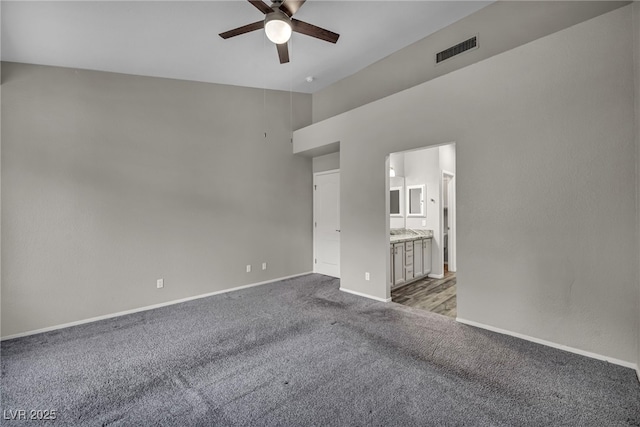 2124 Rising Mist St, Las Vegas, NV 89134 - unfurnished bedroom with carpet, baseboards, high vaulted ceiling, ensuite bath, and ceiling fan