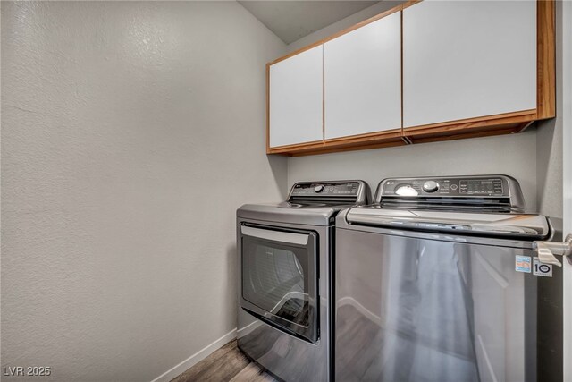 2124 Rising Mist St, Las Vegas, NV 89134 - laundry room with cabinet space, separate washer and dryer, and wood finished floors