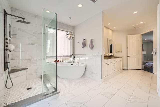full bath featuring a soaking tub, a tile shower, vanity, recessed lighting, and marble look tiles