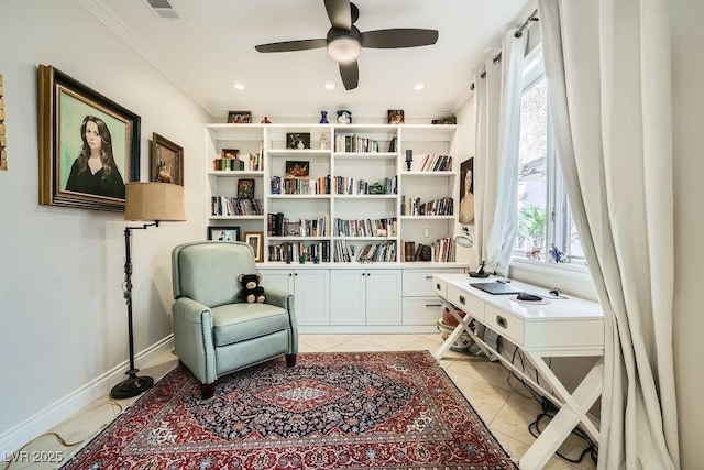 living area with ceiling fan, crown molding, baseboards, an office area, and light tile patterned floors