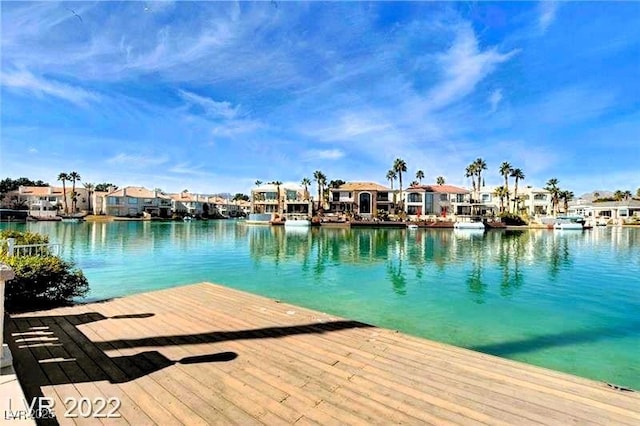 dock featuring a residential view and a water view