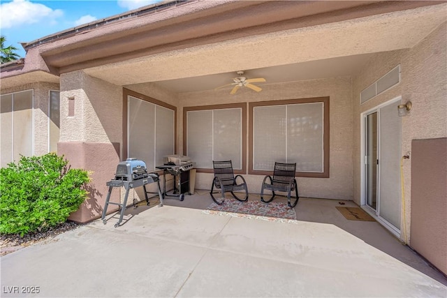 view of patio with ceiling fan and grilling area