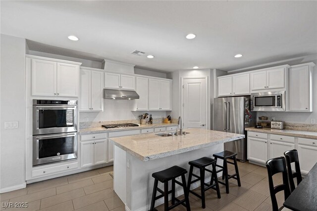 436 Trevinca St, Las Vegas, NV 89138 - kitchen featuring a sink, stainless steel appliances, under cabinet range hood, white cabinetry, and recessed lighting