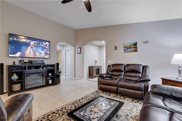 3712 Rocklin Peak Ave, North Las Vegas, NV 89081 - living area with arched walkways, ceiling fan, and light tile patterned flooring