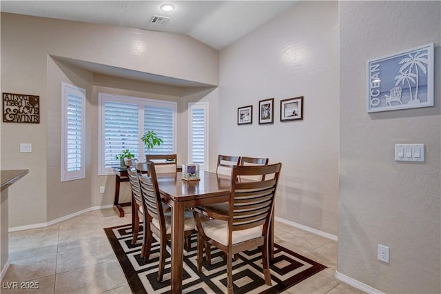 3712 Rocklin Peak Ave, North Las Vegas, NV 89081 - dining area featuring lofted ceiling, light tile patterned floors, and baseboards