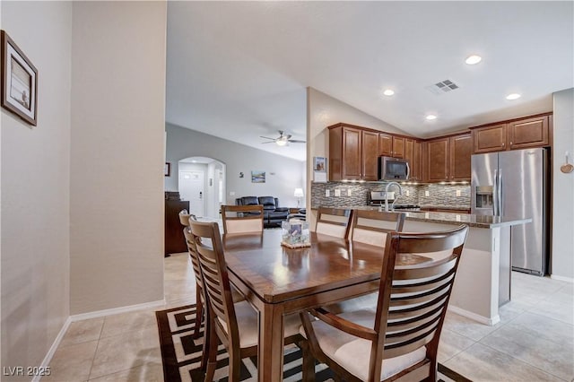 3712 Rocklin Peak Ave, North Las Vegas, NV 89081 - dining room with arched walkways, ceiling fan, lofted ceiling, light tile patterned floors, and recessed lighting