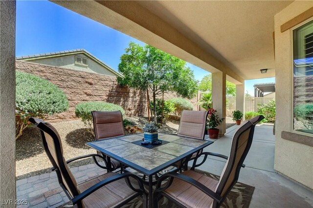 3712 Rocklin Peak Ave, North Las Vegas, NV 89081 - view of patio / terrace featuring outdoor dining area and a fenced backyard