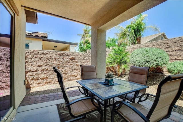 3712 Rocklin Peak Ave, North Las Vegas, NV 89081 - view of patio / terrace featuring outdoor dining space and a fenced backyard