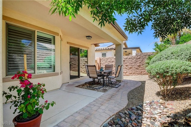 3712 Rocklin Peak Ave, North Las Vegas, NV 89081 - view of patio featuring fence and outdoor dining area