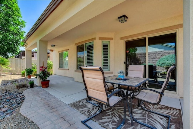 3712 Rocklin Peak Ave, North Las Vegas, NV 89081 - view of patio / terrace with outdoor dining space and fence