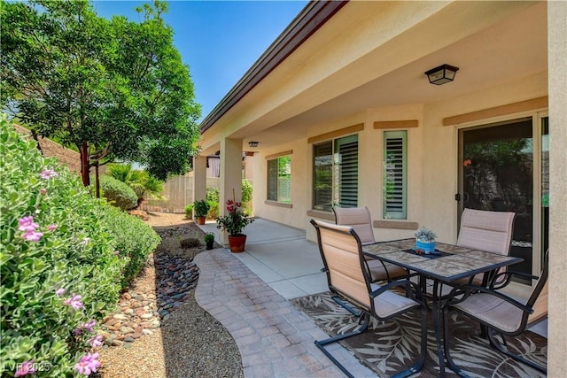 3712 Rocklin Peak Ave, North Las Vegas, NV 89081 - view of patio featuring fence and outdoor dining space