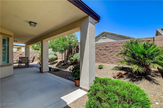 3712 Rocklin Peak Ave, North Las Vegas, NV 89081 - view of patio / terrace with a fenced backyard