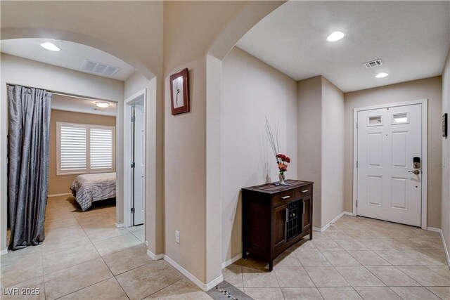 3712 Rocklin Peak Ave, North Las Vegas, NV 89081 - foyer with arched walkways, light tile patterned flooring, baseboards, and recessed lighting