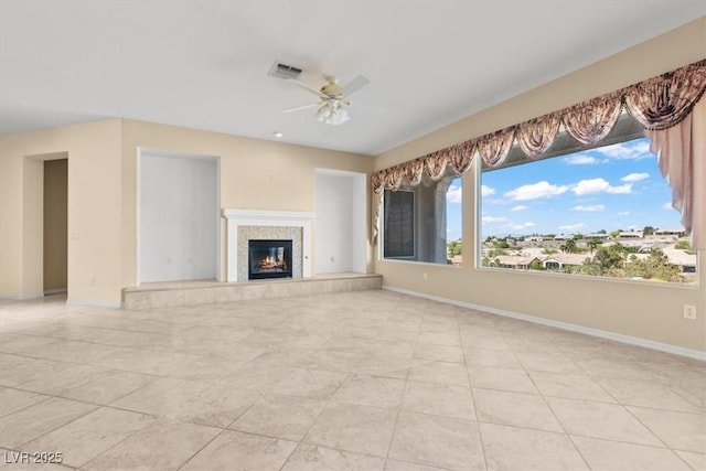 2868 Foxtail Creek Ave, Henderson, NV 89052 - unfurnished living room with ceiling fan, baseboards, a premium fireplace, and light tile patterned floors
