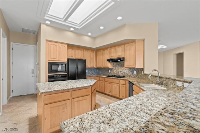 2868 Foxtail Creek Ave, Henderson, NV 89052 - kitchen with black appliances, a sink, light brown cabinets, light stone counters, and backsplash