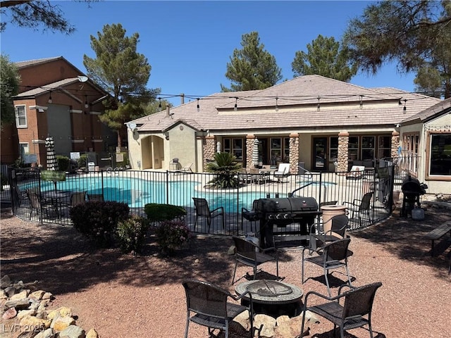 555 E Silverado Ranch Blvd Unit 2052, Las Vegas, NV 89183 - community pool featuring a fire pit, a patio, and area for grilling