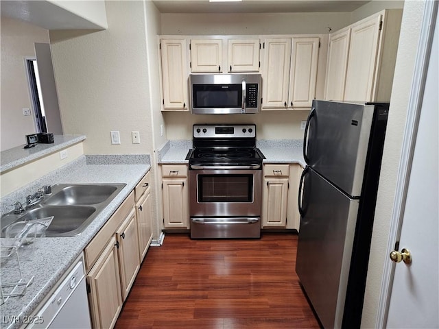 555 E Silverado Ranch Blvd Unit 2052, Las Vegas, NV 89183 - kitchen featuring stainless steel appliances, a sink, dark wood-style floors, and light countertops