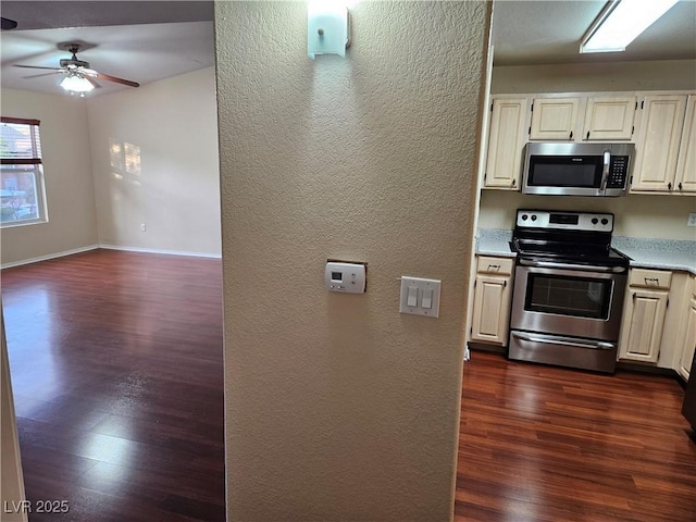 555 E Silverado Ranch Blvd Unit 2052, Las Vegas, NV 89183 - kitchen with stainless steel appliances, dark wood finished floors, a textured wall, light countertops, and ceiling fan