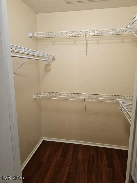 555 E Silverado Ranch Blvd Unit 2052, Las Vegas, NV 89183 - spacious closet with dark wood-type flooring
