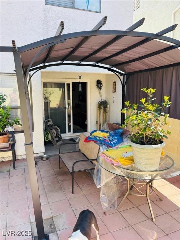 view of patio featuring a pergola and french doors
