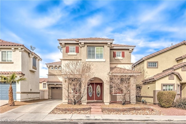 1324 Spice Ridge Ct, Henderson, NV 89012 - mediterranean / spanish house with an attached garage, concrete driveway, stucco siding, and a tile roof