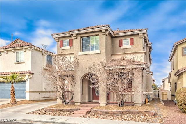 1324 Spice Ridge Ct, Henderson, NV 89012 - view of front of home with fence, driveway, stucco siding, an attached garage, and a tiled roof