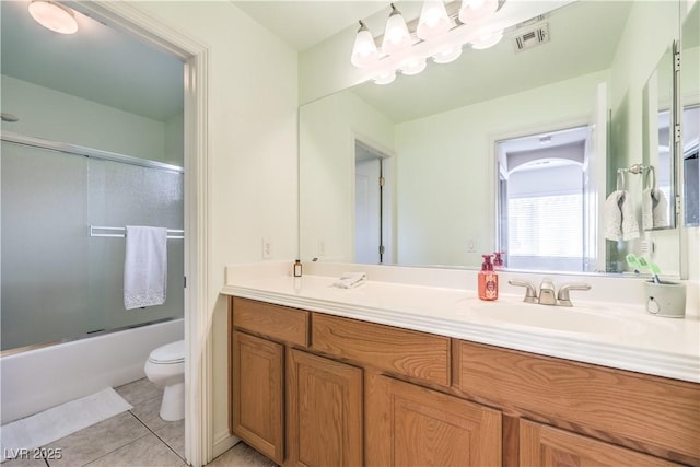 1324 Spice Ridge Ct, Henderson, NV 89012 - full bathroom featuring toilet, tile patterned flooring, double vanity, and shower / bath combination with glass door