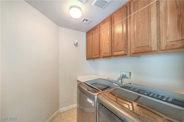 1324 Spice Ridge Ct, Henderson, NV 89012 - washroom with cabinet space, washer and clothes dryer, baseboards, and light tile patterned floors