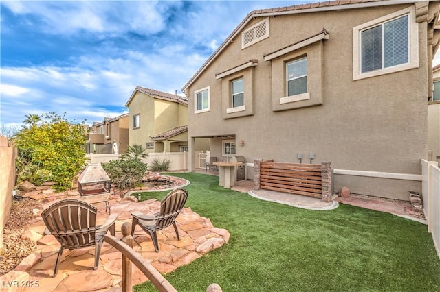 1324 Spice Ridge Ct, Henderson, NV 89012 - back of property featuring stucco siding, a patio area, and a tiled roof