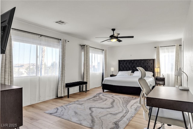 bedroom featuring wood finished floors and ceiling fan