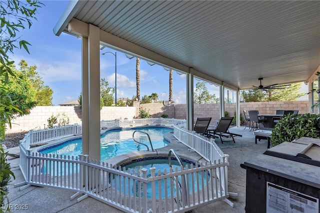 3194 Lapis Beach Dr, Las Vegas, NV 89117 - view of swimming pool with an in-ground hot tub, outdoor dining area, a fenced backyard, and a patio area