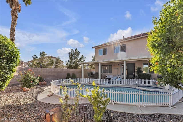 view of swimming pool with a fenced backyard and a patio