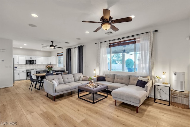 3194 Lapis Beach Dr, Las Vegas, NV 89117 - living area with ceiling fan, healthy amount of natural light, recessed lighting, and light wood-type flooring