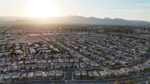 view of property location with mountains and nearby suburban area
