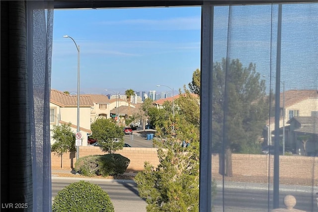 water view featuring nearby suburban area and fence