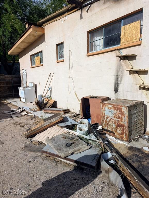 view of property exterior featuring concrete block siding